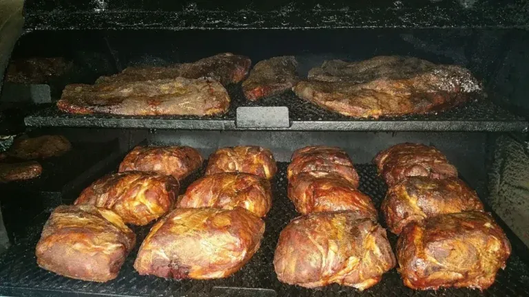 Smoked Pork Shoulder Brisket In The Smoker.webp Rogerthat.com © 2025