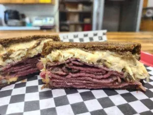 Ruben With Smoked Pastrami On Toasted Marble Rye Bread Smothered With Sourkrawt Cold Smoked Swiss Cheese And Our In House 100